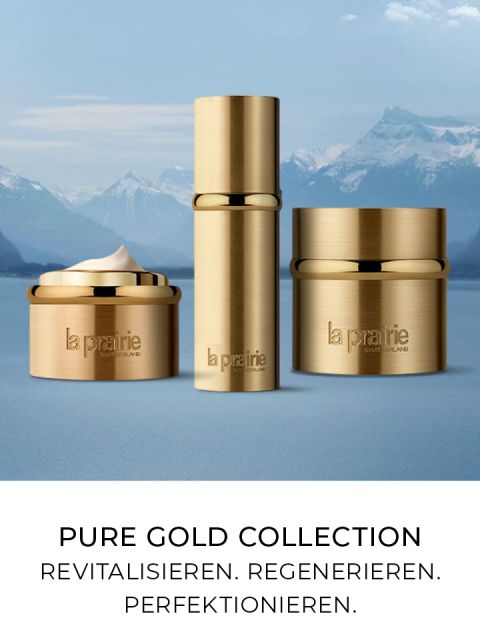 Contenitori con coperchi dorati dei prodotti per la cura della pelle della collezione Pure Gold di La Prairie presentati sullo sfondo di montagne innevate. Il testo sottostante recita: "Collezione Pure Gold. Rivitalizzare. Rigenerare. Perfezionare."