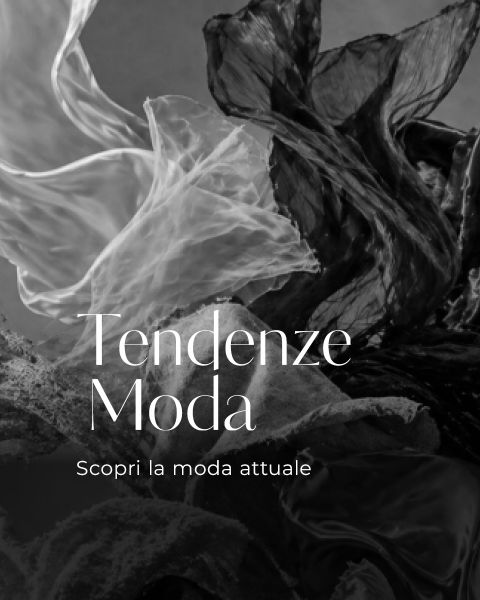 Immagine in bianco e nero con strutture di tessuto fluide e il testo italiano "Tendenze Moda. Scopri la moda attuale" in un carattere elegante.