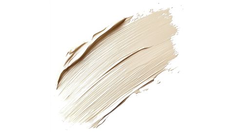 Un campione di fondotinta beige e cremoso su sfondo bianco con pennellate lisce e strutturate.