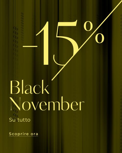 Il testo giallo su uno sfondo scuro con sfumatura recita: "-15% Black November su tutto. Scopri ora." Il testo è progettato con stile e pubblicizza uno sconto del 15% su tutti gli articoli nell'ambito di un saldo "Black November".