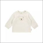 Ein langärmeliges, hellbeiges Baby-Shirt mit einem einfachen Bärengesichts-Aufnäher auf der Brust, der auf einem schlichten weißen Hintergrund abgebildet ist.