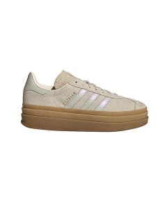 Sneaker Adidas Gazelle beige con strisce bianche, scritta dorata "GAZELLE" e una spessa suola in gomma su sfondo bianco.