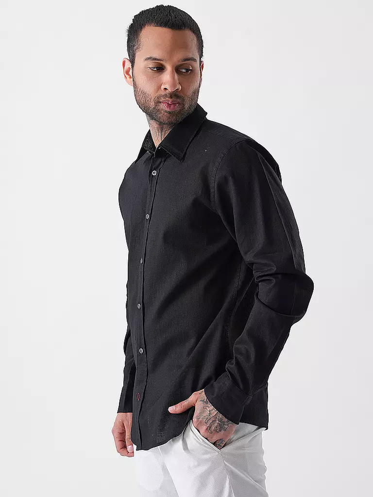 JOOP | Camicia slim fit HANSON
Marke: JOOP
Colore: nero
Categorie: Moda, Uomo

Lunghezza manica: Manica lunga
Materiale: Lino, Cotone
Forma colletto: Collo Kent
Motivo: Tinta unita
Vestibilità (capispalla): Slim
Stile: Smart Business
Dettagli: Mélange | Nero