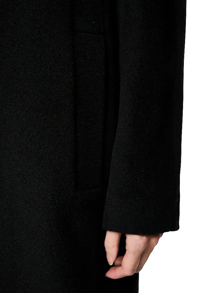 MARC CAIN | Cappotto di lana
Marca: MARC CAIN
Colore: nero
Categorie: Moda, Donna

Lunghezza manica: Manica lunga
Materiale: Alpaca
Tipo di colletto: Rever
Motivo: Tinta unita
Vestibilità (capispalla): Ampia
Stile: Glamour
Dettagli: Tasche a fessura | 