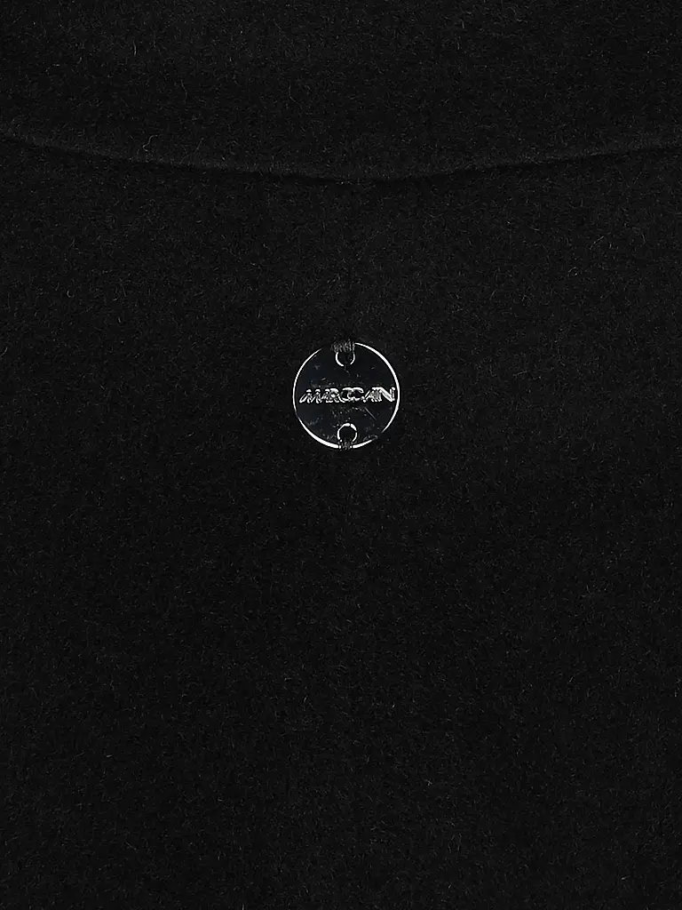 MARC CAIN | Cappotto di lana
Marca: MARC CAIN
Colore: nero
Categorie: Moda, Donna

Lunghezza manica: Manica lunga
Materiale: Alpaca
Tipo di colletto: Rever
Motivo: Tinta unita
Vestibilità (capispalla): Ampia
Stile: Glamour
Dettagli: Tasche a fessura | 