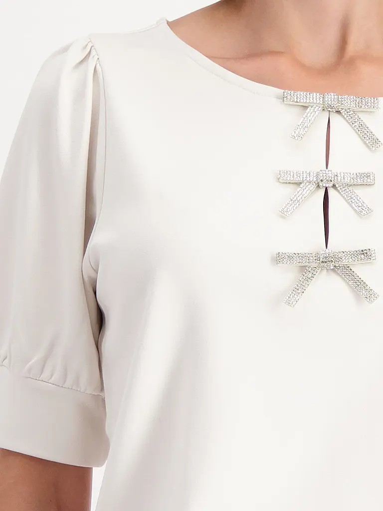 MONARI | T-Shirt
Marke: MONARI
Farbe: beige
Kategorien: Moda, Donna

Lunghezza manica: Manica corta
Scollatura: Girocollo
Materiale: Jersey, Viscosa, Stretch
Motivo: Tinta unita
Vestibilità (capispalla): Regular
Stile: Glamour
Dettagli: Strass | Beige